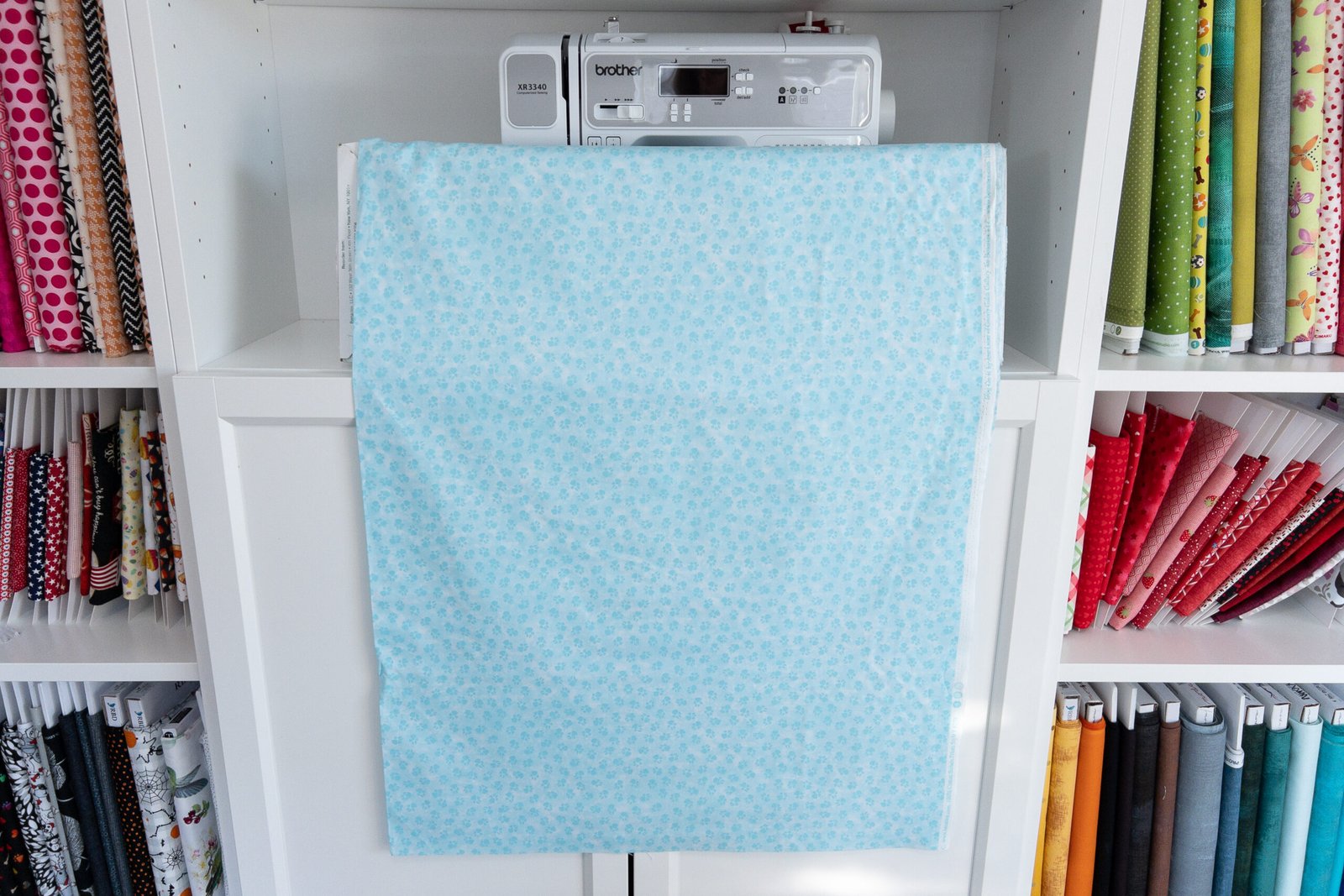 Paw print fabric in light teal from the "Dog On It" collection by Benartex - Image 3