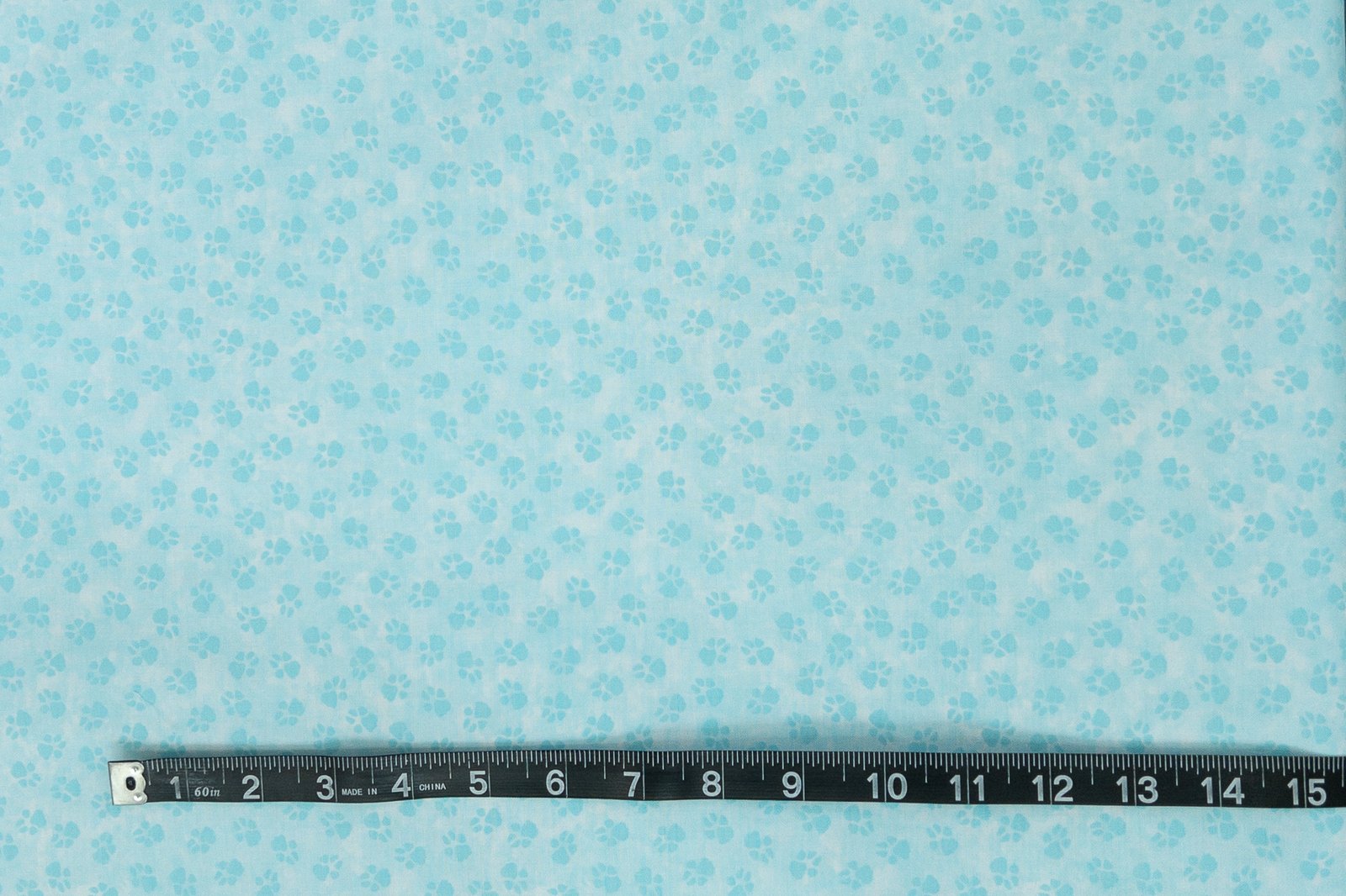 Paw print fabric in light teal from the "Dog On It" collection by Benartex - Image 4