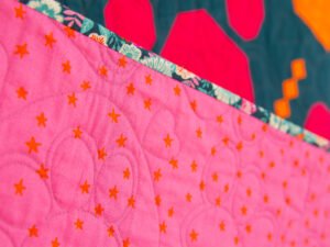 Closeup of quilting on Paw Prints on My Heart Quilt.